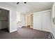 Upper-level bedroom with double closets, access to upper hallway, and a window at 1843 Spruce St, Boulder, CO 80302