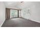 Spacious bedroom with a private balcony, carpeted floors, and plenty of natural light at 1843 Spruce St, Boulder, CO 80302