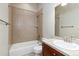 Basement bathroom with tub, shower, toilet and vanity at 22554 E Peakview Pl, Aurora, CO 80016