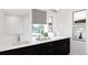 Modern bathroom with double vanity, large mirror, and a walk-in shower at 3833 Whispering Sage St, Evergreen, CO 80439