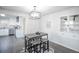 Dining area with four chairs and a view into an updated kitchen at 204 S 5Th Ave, Brighton, CO 80601