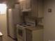 Kitchen with white appliances and light wood cabinets at 1845 N Kendall St # 316D, Lakewood, CO 80214