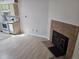 Living room with fireplace and wood laminate flooring at 1845 N Kendall St # 316D, Lakewood, CO 80214
