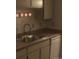 Small kitchen with stainless steel sink and white cabinets at 1845 N Kendall St # 316D, Lakewood, CO 80214