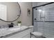 Bathroom with granite countertop, black fixtures and a walk-in shower at 23890 E Minnow Dr, Aurora, CO 80016