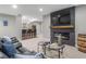 Finished basement with a fireplace, bar area, and comfortable seating at 23890 E Minnow Dr, Aurora, CO 80016