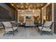 Cozy covered patio features string lights and comfortable seating at 23890 E Minnow Dr, Aurora, CO 80016