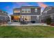 Gray two-story house with a large backyard and patio at 23890 E Minnow Dr, Aurora, CO 80016