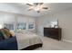 Comfortable bedroom with ample natural light and a ceiling fan at 23890 E Minnow Dr, Aurora, CO 80016
