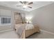 Bedroom with a queen bed, neutral wall colors, and a ceiling fan at 23890 E Minnow Dr, Aurora, CO 80016