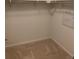 Large walk-in closet with neutral carpeting and ample storage space at 4630 Copeland Cir # 102, Highlands Ranch, CO 80126