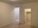Simple bedroom with neutral walls, carpeting, and access to closet and hallway at 4630 Copeland Cir # 102, Highlands Ranch, CO 80126