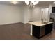 Spacious living room with hardwood floors and kitchen island at 4630 Copeland Cir # 102, Highlands Ranch, CO 80126