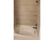 Bathroom with large bathtub, neutral tile, and modern fixtures at 4630 Copeland Cir # 102, Highlands Ranch, CO 80126