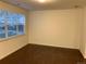 Simple bedroom with hardwood floors and large window at 4630 Copeland Cir # 102, Highlands Ranch, CO 80126
