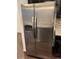 Stainless steel side-by-side refrigerator at 4630 Copeland Cir # 102, Highlands Ranch, CO 80126