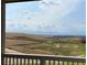 Scenic view of mountains and open fields from a deck at 1145 Raindance Pl, Erie, CO 80516