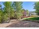 Large backyard with gravel and a view of the house at 6095 Bridle Path Ln, Parker, CO 80134