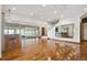 Open great room with hardwood floors and views to wet bar and pool at 1175 Ridge Oaks Dr, Castle Rock, CO 80104
