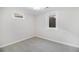 Finished basement bedroom with carpet, neutral walls, and two windows at 6035 Everett St, Arvada, CO 80004