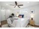 Main bedroom with ceiling fan, ample natural light, and a cozy atmosphere at 6035 Everett St, Arvada, CO 80004