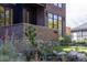 Close-up view of the house's brick facade and landscaping at 3362 W 32Nd Ave, Denver, CO 80211