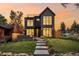 Stunning two-story brick house exterior at sunset at 3362 W 32Nd Ave, Denver, CO 80211