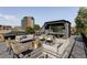Elegant rooftop deck featuring a fire pit and city views at 3362 W 32Nd Ave, Denver, CO 80211