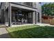 Charming backyard patio with dining set and grassy area at 3362 W 32Nd Ave, Denver, CO 80211