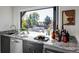 Modern kitchen with granite countertop and outdoor access at 3362 W 32Nd Ave, Denver, CO 80211