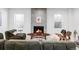 Spacious basement Gathering room featuring a fireplace and comfortable seating at 3362 W 32Nd Ave, Denver, CO 80211
