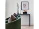 Green chairs and console table with modern decor at 3362 W 32Nd Ave, Denver, CO 80211
