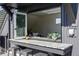 Rooftop bar with granite countertop and outdoor seating at 3362 W 32Nd Ave, Denver, CO 80211