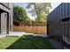 Landscaped backyard with grassy area and wooden fence at 3362 W 32Nd Ave, Denver, CO 80211