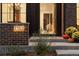Modern house number, 3362, illuminated at night, brick wall at 3362 W 32Nd Ave, Denver, CO 80211