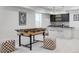 Modern basement wet bar with stylish cabinetry and seating at 3362 W 32Nd Ave, Denver, CO 80211