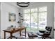 Bright home office with large windows and a comfortable armchair at 3362 W 32Nd Ave, Denver, CO 80211