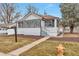 Charming bungalow with a freshly landscaped front yard at 2300 Galena St, Aurora, CO 80010