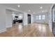 Open concept living room and kitchen with hardwood floors at 2300 Galena St, Aurora, CO 80010