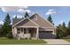 One-story home with gray siding, stone accents, and a two-car garage at 24732 E Atlantic Dr, Aurora, CO 80018