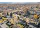 Aerial view showcasing home's location in a residential neighborhood with mountain views at 1642 S Mabry Way, Denver, CO 80219