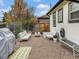 Relaxing patio area with gravel, seating, and grill at 1642 S Mabry Way, Denver, CO 80219