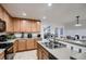 Kitchen boasts ample counter space and a double sink at 19045 E 57Th Pl, Denver, CO 80249