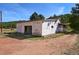 Exterior view of the house with attached garage at 2677 S Platte River Rd, Sedalia, CO 80135