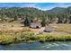 Property showcasing home, shed and river access at 2677 S Platte River Rd, Sedalia, CO 80135