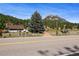 House exterior with mountain views and vintage truck at 2677 S Platte River Rd, Sedalia, CO 80135