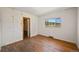 Bedroom with hardwood floors and view from the window at 2677 S Platte River Rd, Sedalia, CO 80135