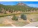 Rustic home nestled on a scenic riverside property at 2677 S Platte River Rd, Sedalia, CO 80135