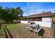 Cozy patio area with picnic table and grill at 2677 S Platte River Rd, Sedalia, CO 80135
