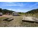 Serene backyard with a deck, shed, and mountain views at 2677 S Platte River Rd, Sedalia, CO 80135